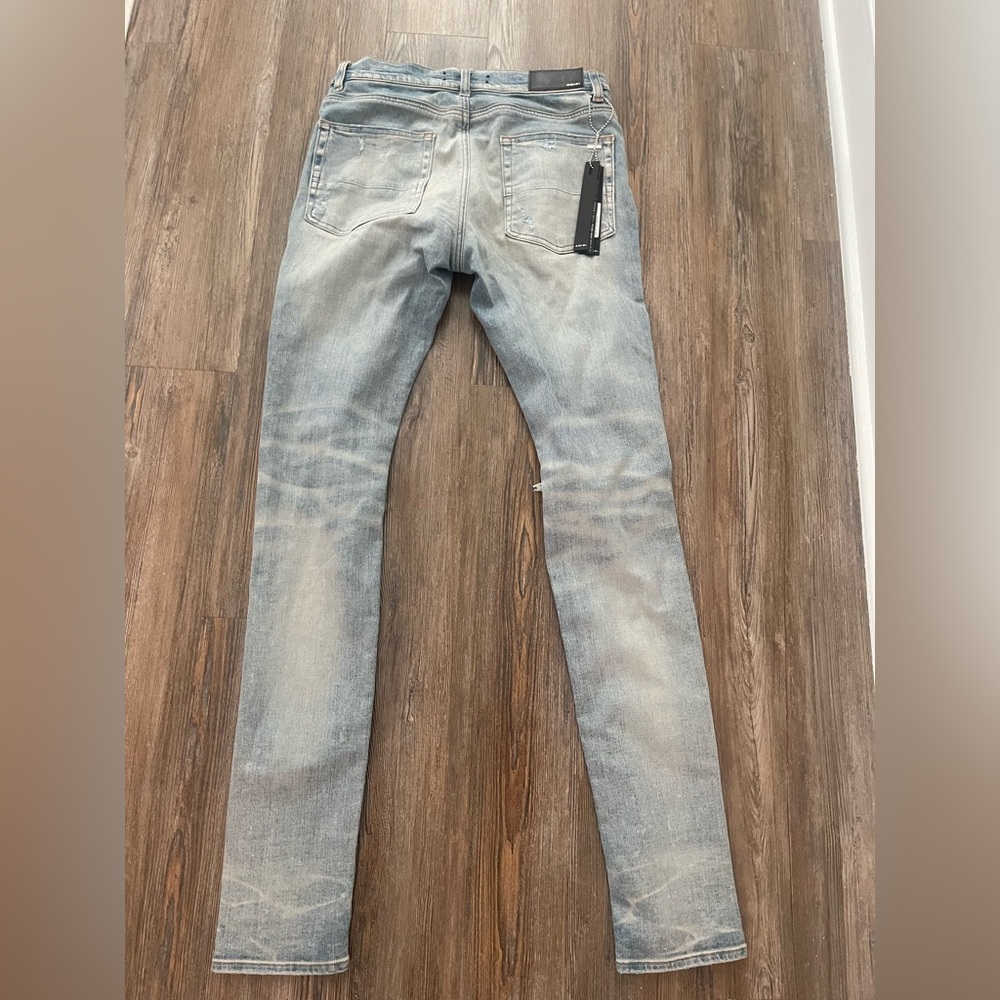 AMIRI Light Blue Distressed Skinny Jeans - Picture 2 of 3